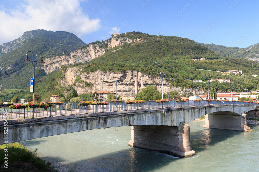 River Adige, bridge and mountain alps panorama in Trento, Italy