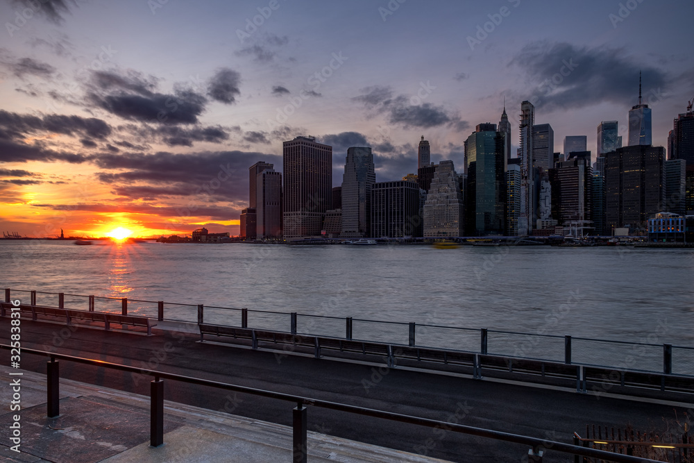 Sunset Over East River Lower Manhattan Skyline View From Brooklyn Bridge Park