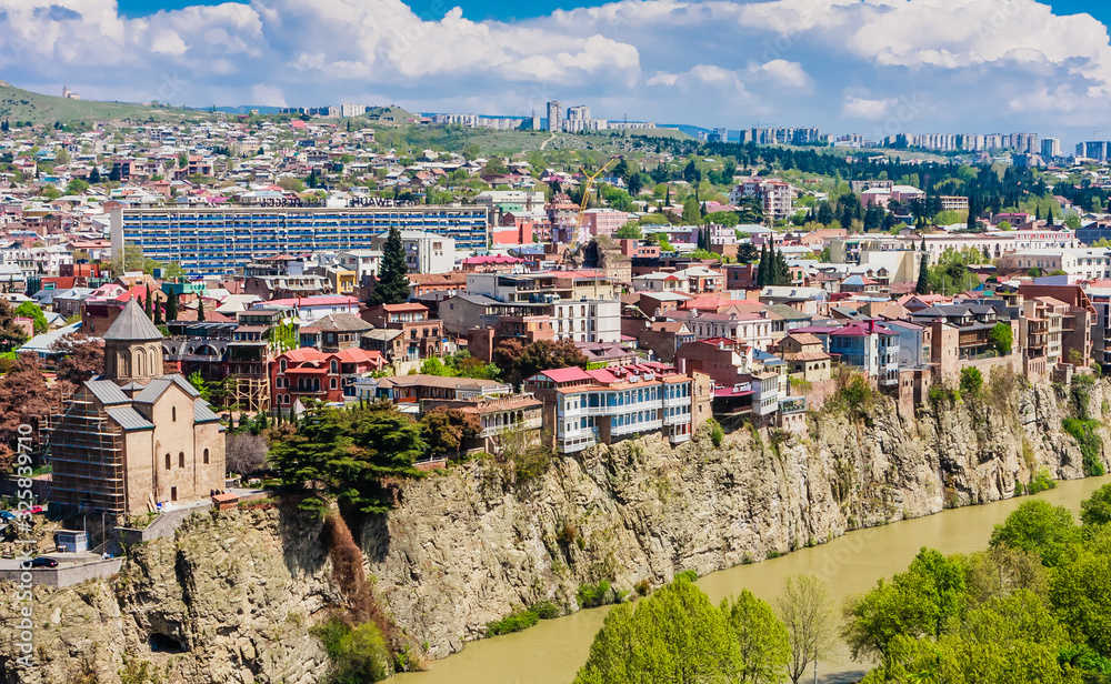 Fototapeta premium Panoramic view of Tbilisi city from Sololaki Hill, old town and modern architecture. Georgia