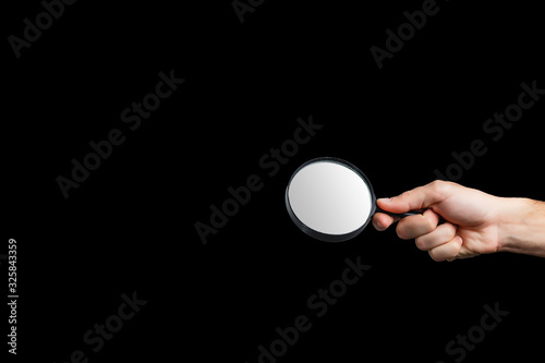 Magnifying glass on a black background