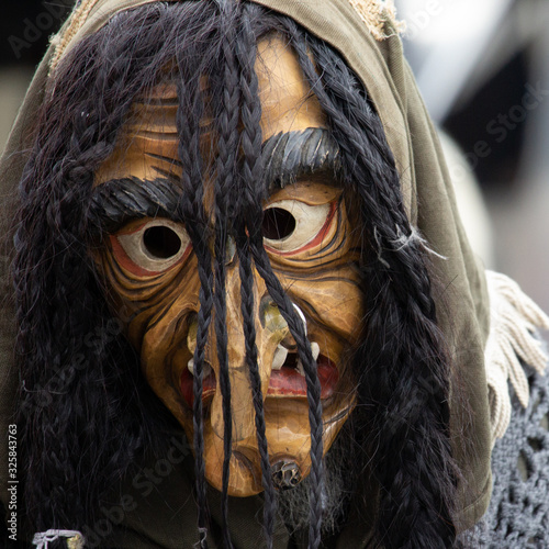 Closeup Portrait of a masked person on a carnival parade
