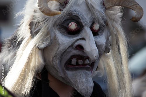 Closeup Portrait of a masked person on a carnival parade