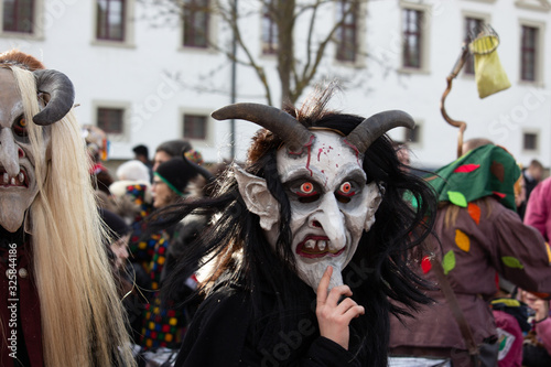 Closeup Portrait of a masked person on a carnival parade