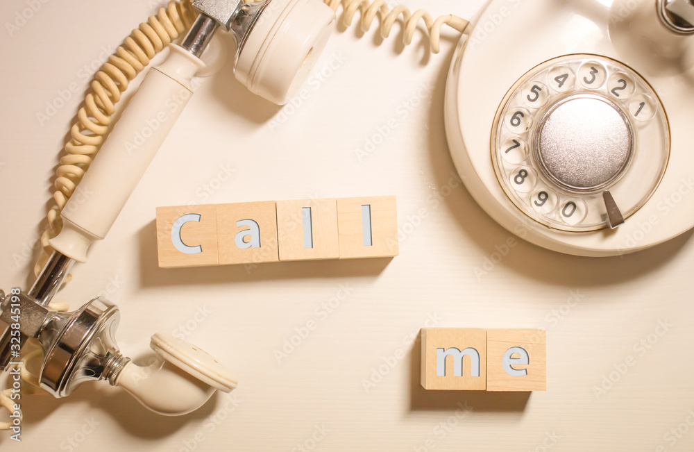 The diary blanks with retro telephone on the wooden table The diary blanks with retro telephone on the wooden table