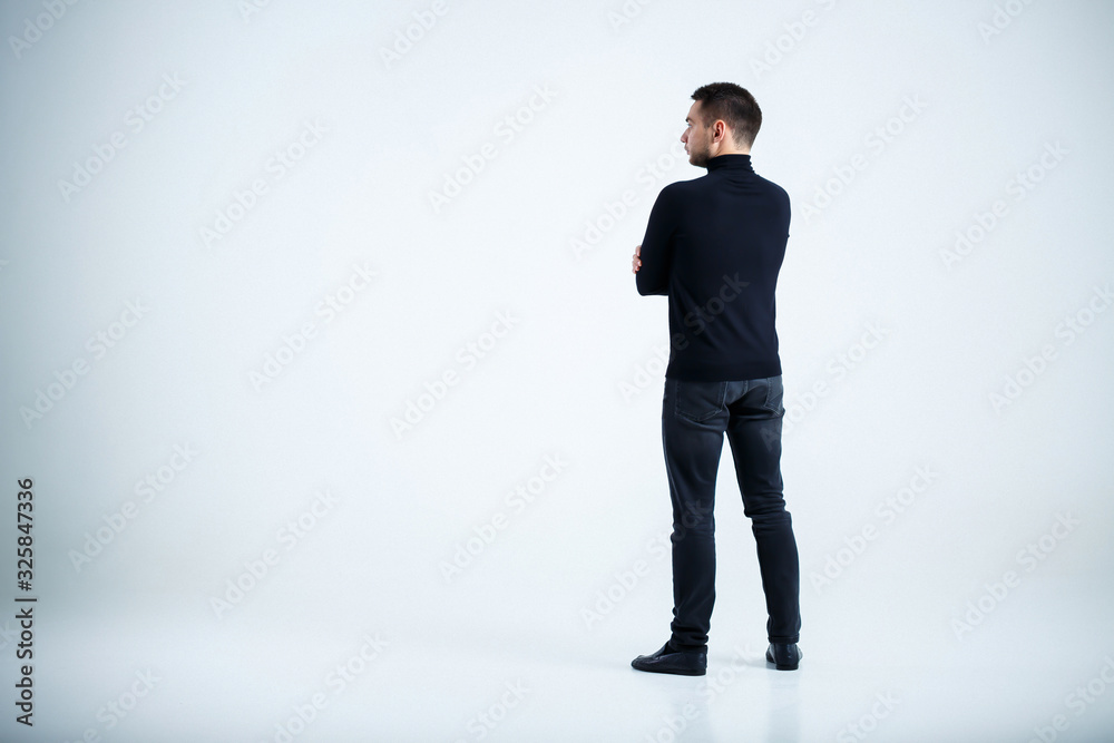 young businessman in black golf and jeans young businessman in black golf and jeans