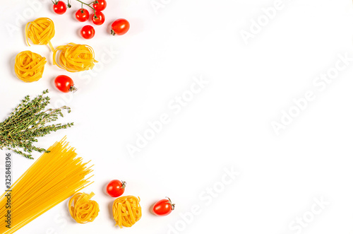 Raw tagliatelle pasta, spaghetti with tomatoes, thyme on a light background, copy space for text, flat lay