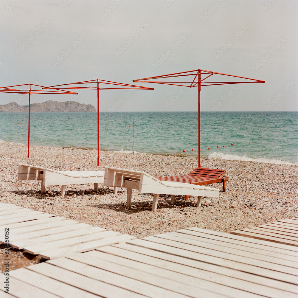 Beautiful umbrellas stand on the seashore Beautiful umbrellas stand on the seashore