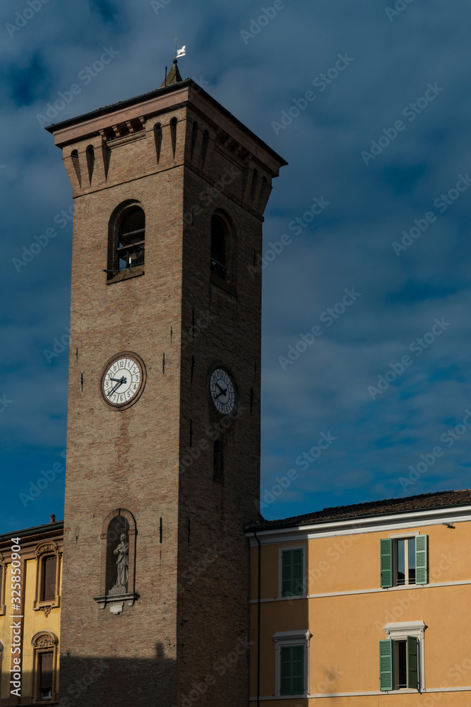 Clock tower on square Piazza della Liberta, in Bagnacavallo, Italy