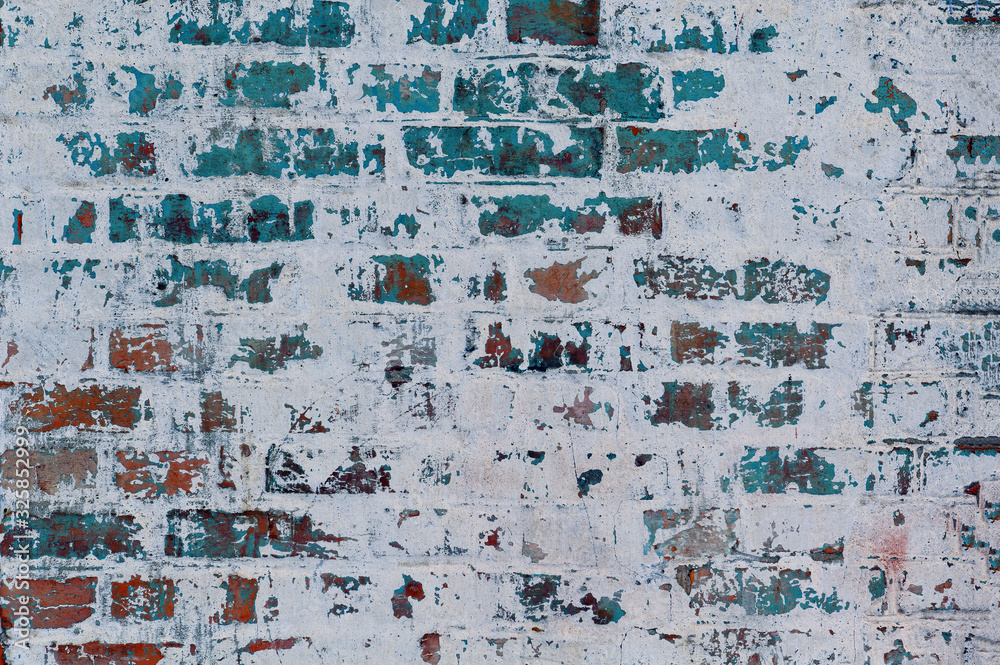 Gray background old plastered brick wall with elements of blue paint Gray background old plastered brick wall with elements of blue paint
