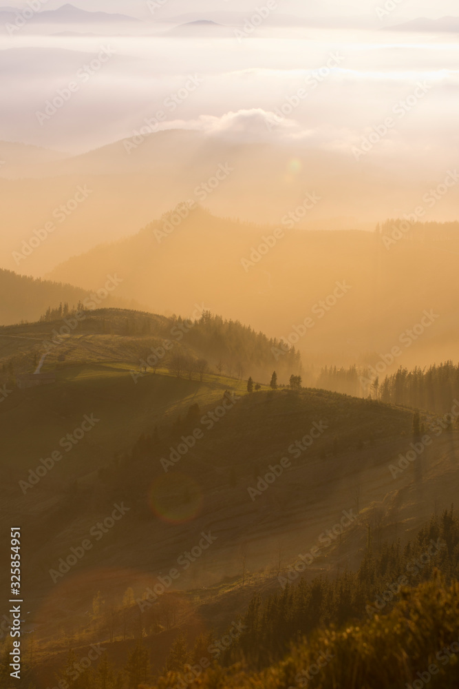 Obraz premium sunset on the green hills in basque country, spain