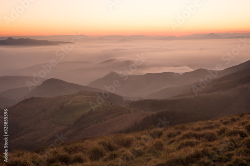 sunset over the mountains in the basque country, spain