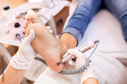 Pedicure treatment of heel skin area photo