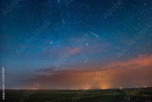 Wall Mural dramatic sky with clouds and meteorite