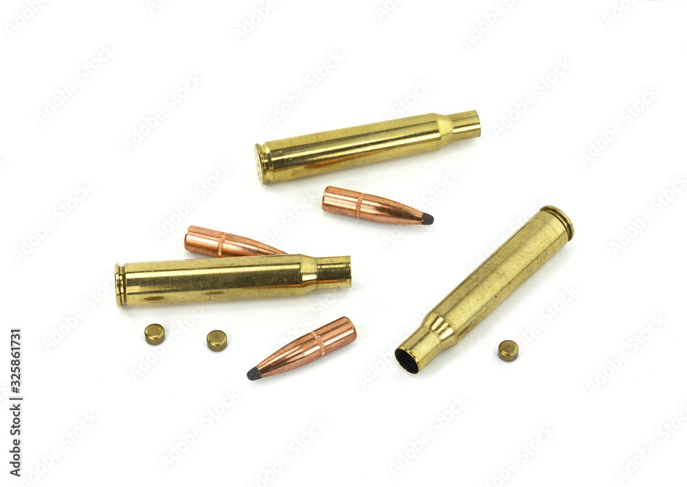 A rifle bullet, empty shell, gunpowder on white background. Hunting ammunition isolated on white. A rifle bullet, empty shell, gunpowder on white background. Hunting ammunition isolated on white.