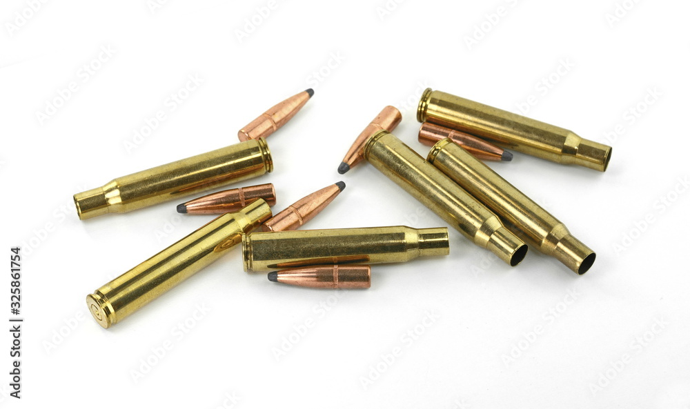 A rifle bullet, empty shell, gunpowder on white background. Hunting ammunition isolated on white. A rifle bullet, empty shell, gunpowder on white background. Hunting ammunition isolated on white.
