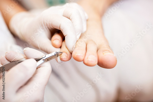 Obraz na plátně Pedicure nail treatment for healthy looking toenails