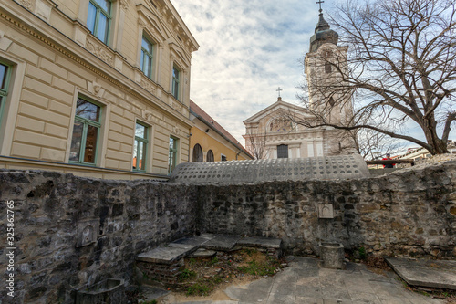 Ruins of Memi Pasa's Bath with the Francisan Church in the background in Pecs photo