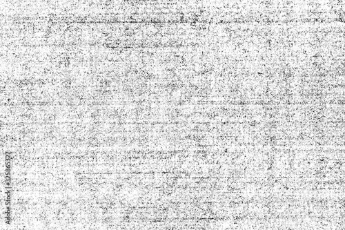 Grunge texture of old shabby paper. Vintage monochrome background of an aged empty book page with small noise, horizontal stripes, spots and graininess. 