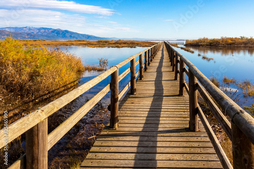 Nature wooden boardwalk in Lake Vistonida  Porto Lagos  Xanthi regional unit  Greece on a sunny winter day