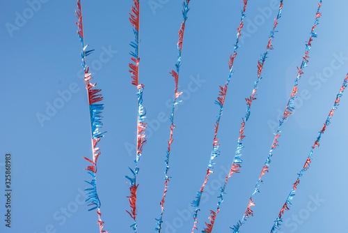 american flags on blue sky