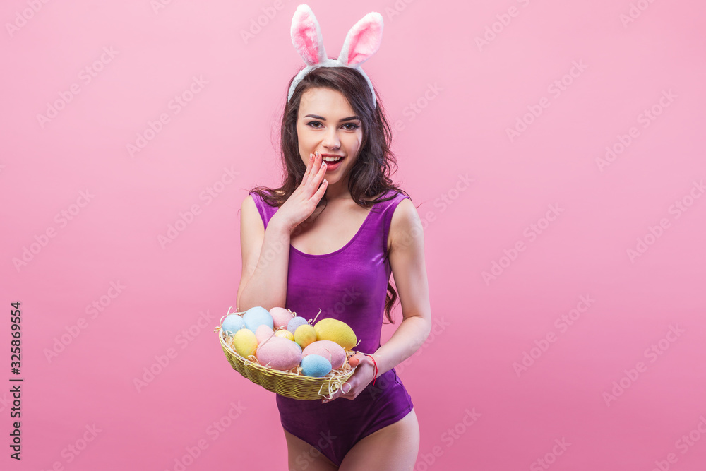 Attractive hot young woman wearing bodysuit and bunny ears posing on ...