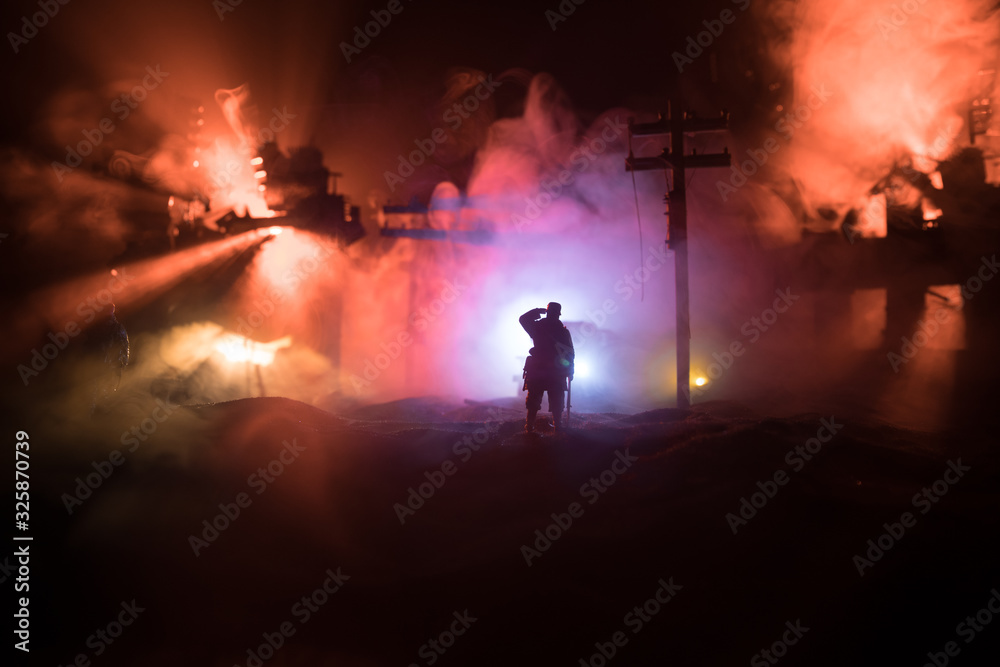 Fototapeta premium War Concept. Military silhouettes fighting scene on war fog sky background, World War Soldiers Silhouette Below Cloudy Skyline At night.