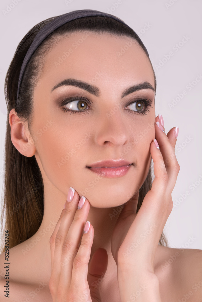 Beautiful girl touches her face. Woman puts makeup. Beautiful girl touches her face. Woman puts makeup.