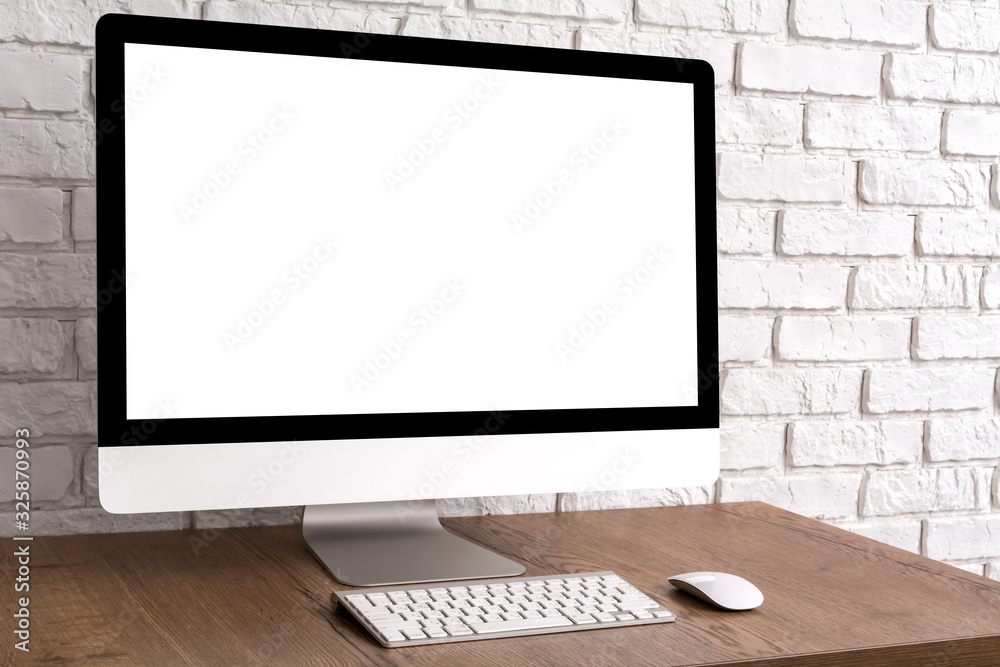 Mock up blank screen computer desktop with keyboard and mouse on wooden table. Mock up blank screen computer desktop with keyboard and mouse on wooden table.