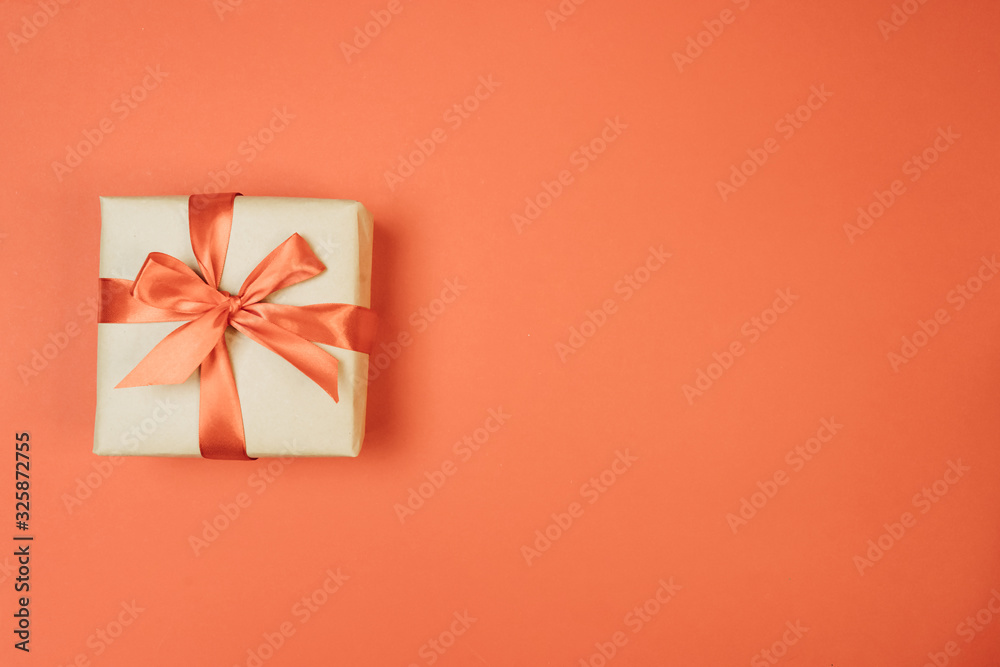 gift on red background with bow