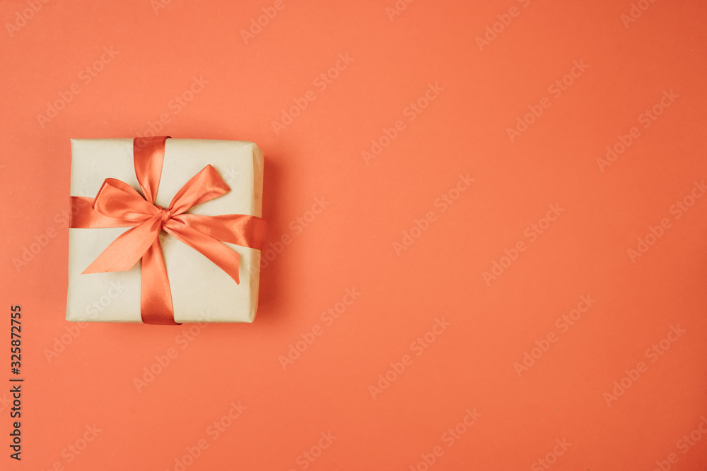 gift on red background with bow gift on red background with bow