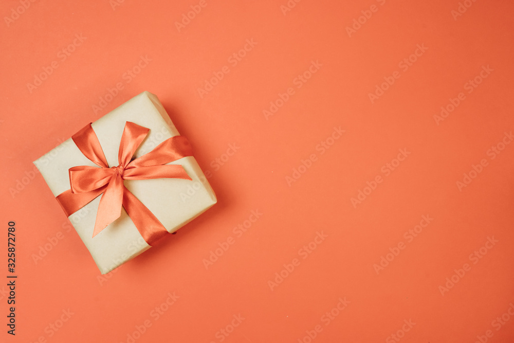 gift on red background with bow gift on red background with bow