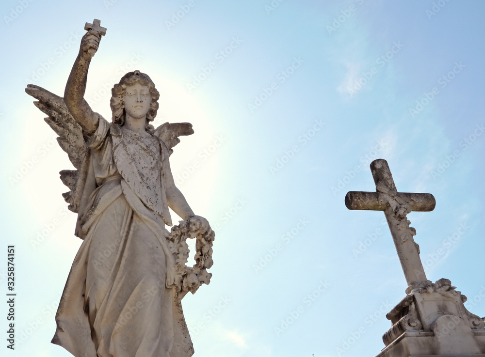 Catholic sculptures and christian symbols in a Spanish cemetery 