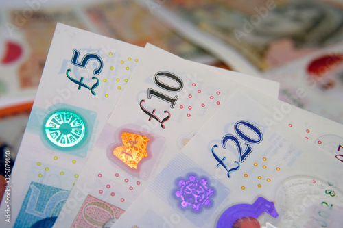 New British polymer money. The banknote 5, 10, 20 Sterling Pound notes which released by February 2020 in the United Kingdom. photo