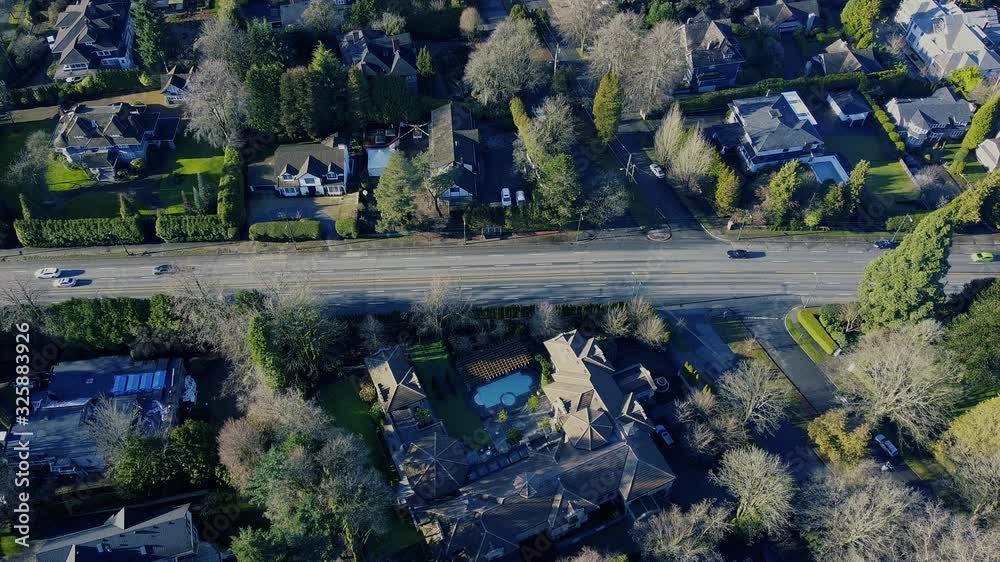 Green neighbourhood with nice houses and a small highway Green neighbourhood with nice houses and a small highway