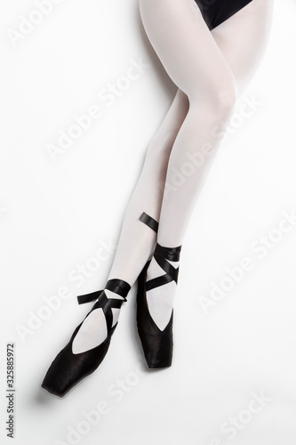Sport Concepts. Ballet Dancer Sexy Legs In Laced Pointes Shoes. Posing With Straight and Crossed Legs.