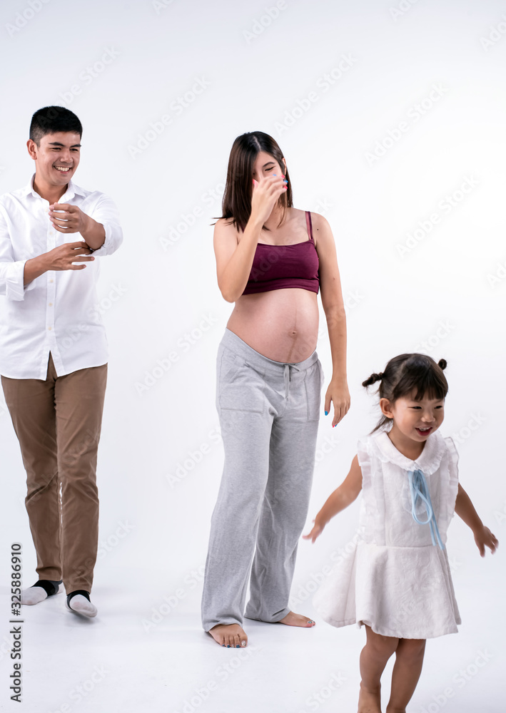 The beautiful pregnant woman and famly,husband and daughter,Happy emotion The beautiful pregnant woman and famly,husband and daughter,Happy emotion
