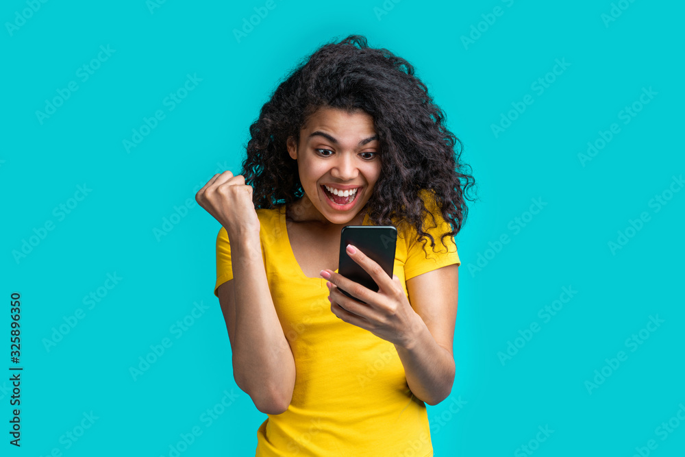 Portrait of attractive young african american girl using mobile phone Portrait of attractive young african american girl using mobile phone