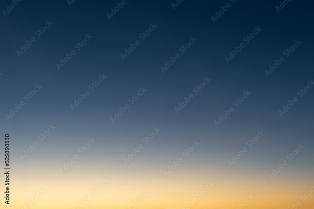 Heaven at early morning with copy space. Sunset, sunrise backdrop.Predawn clear sky with orange horizon and blue atmosphere. Smooth orange blue gradient of dawn sky. Heaven at early morning with copy space. Sunset, sunrise backdrop.Predawn clear sky with orange horizon and blue atmosphere. Smooth orange blue gradient of dawn sky.
