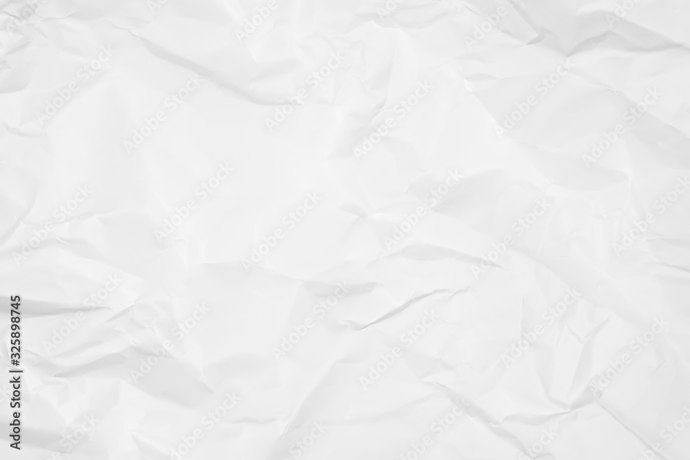 White crumpled paper texture background. Clean white paper. Top view. White crumpled paper texture background. Clean white paper. Top view.
