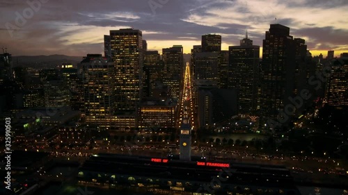 Marvellous aerial drone flight over calm ocean river in San Francisco evening light downtown skyline sunset cityscape