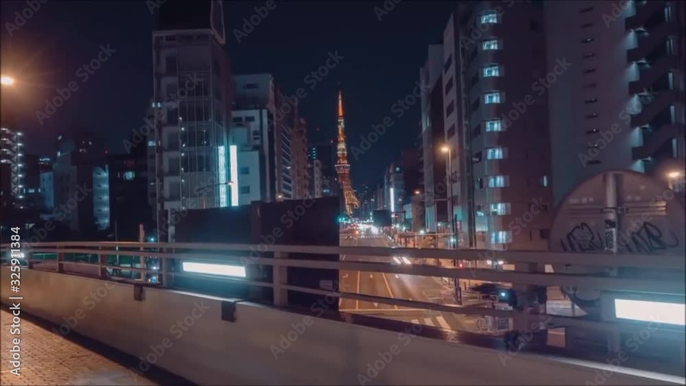 Impressive aerial time lapse view on busy traffic urban highway road in bright night light modern downtown architecture