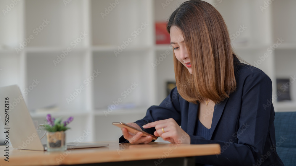 Cropped shot of businesswoman take a break and relaxing with smartphone Cropped shot of businesswoman take a break and relaxing with smartphone