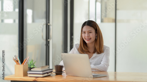 Cropped shot of  of businesswoman sit at her working place in comfortable office room