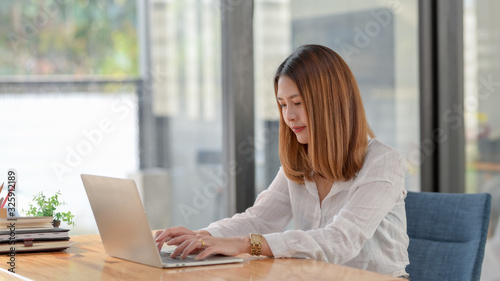 Cropped shot of businesswoman working while sitting at her working place