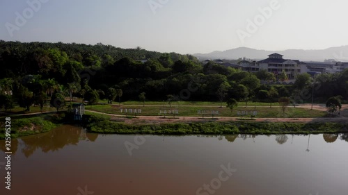 4k Aerial morning view town of Kulim, Kedah, Malaysia. The Kulim District is a district and town in the state of Kedah, Malaysia. It is located on the southeast of Kedah, bordering Penang.  photo