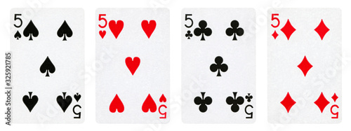 Four Playing Cards Isolated on White Background, Showing Fives from Each Suit - Hearts, Clubs, Spades and Diamonds photo