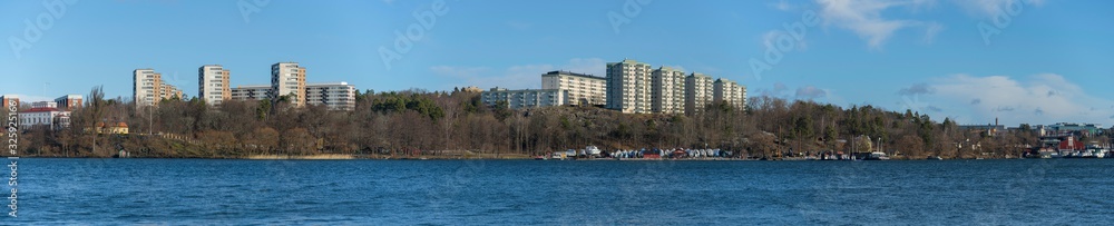 View from the Stockholm district Traneberg over the bay Ulvsundasjön sourunded by the town Solna and the district Kristineberg, Johannelund jetty, pier and bouys a 