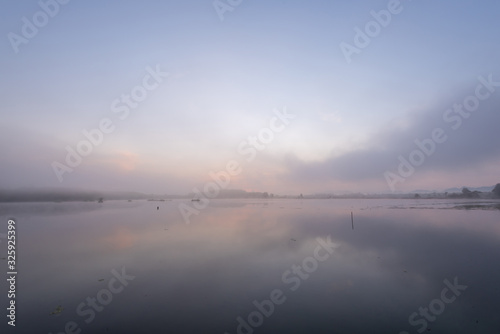 Morning nature scene  sky  clouds and fog  mist  on the lake