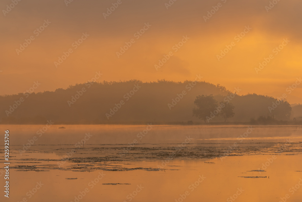 Morning nature scene, sky, clouds and fog (mist) on the lake