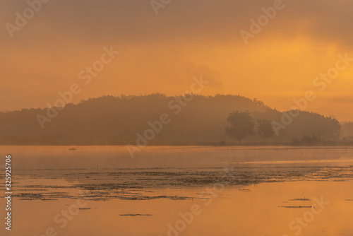 Morning nature scene  sky  clouds and fog  mist  on the lake